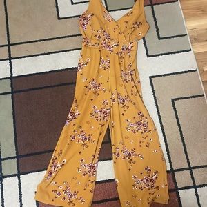 Size small floral jumper. Worn but well taken care of